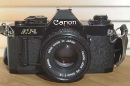 Rare Black Canon AV1 35mm SLR Camera With 50mm f1.8 Lens. Fantastic condition St - $250.00