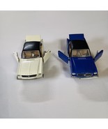 2 1965 Ford Mustangs Diecast Toy Cars Blue And Cream Pull Back Action Po... - $272.80 MXN