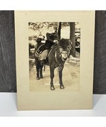 1940s 2 year old girl smiling on a pony black and white photo - $23.76