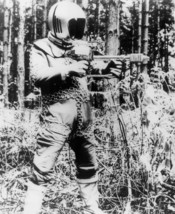1970’s UFO armed space suited alien in forest setting b/w 8x10 scene. - $6.49