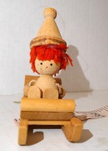 Vintage unpainted wooden XMAS ornament Elf on Sled early 70&#39;s red yarn hair - £13.35 GBP