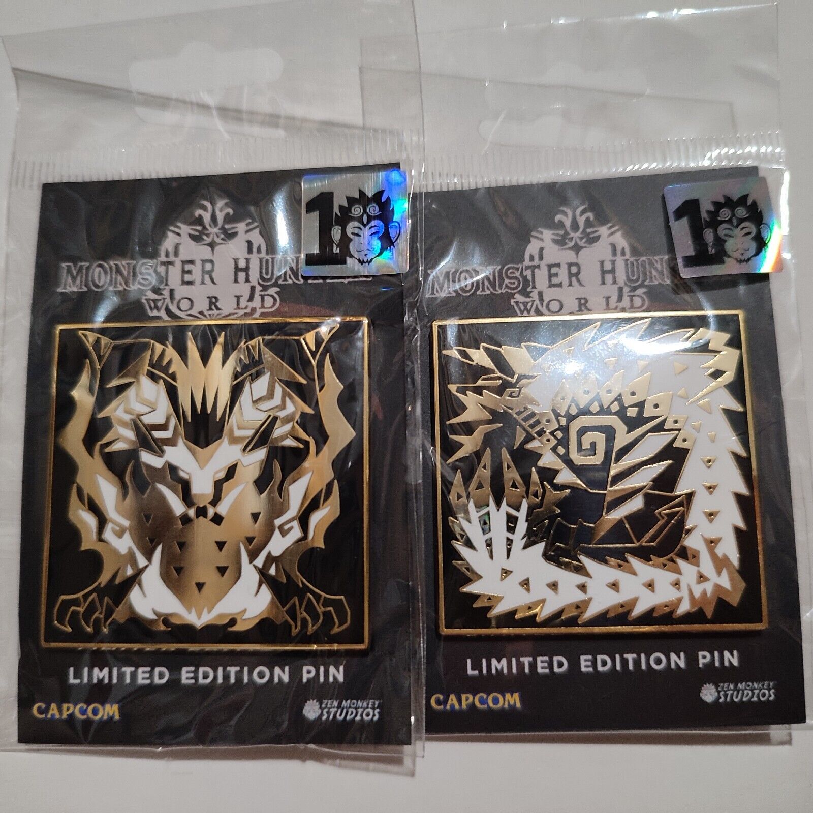 Primary image for Monster Hunter World Zinogre and Teostra Symbols Enamel Pins Official Set Of 2