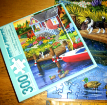 Jigsaw Puzzle 300 Large Pieces Lakeside Cabin Boat Dock Border Collie Co... - $12.86