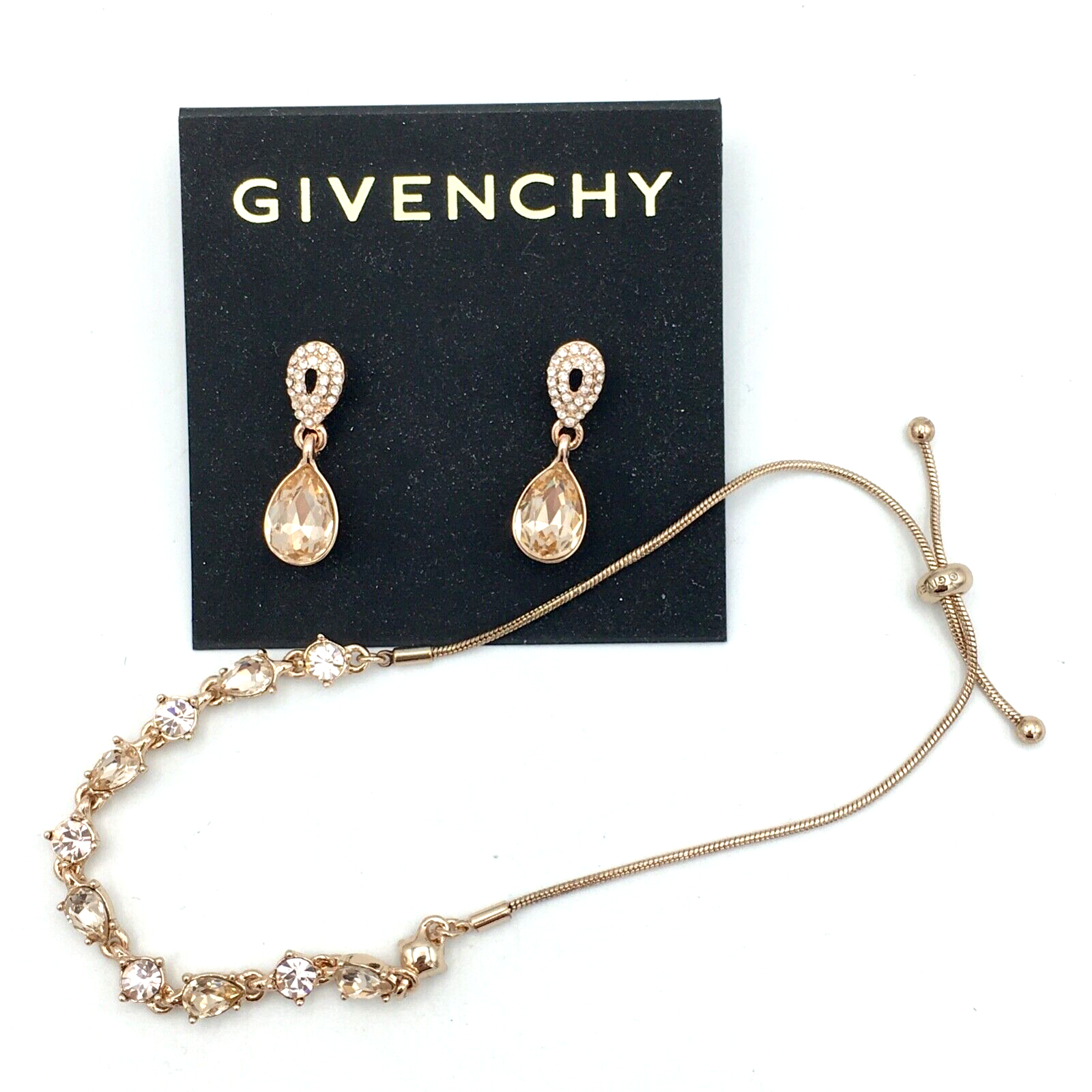 GIVENCHY rose gold tone peachy pink crystal drop earrings & slide bracelet set - $40.00