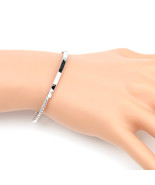 Silver Tone Twisted Bangle Bracelet With Trendy Bar Design - $22.99