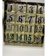 Old 16-sided slide puzzle with plastic numbers - $208.00 MXN