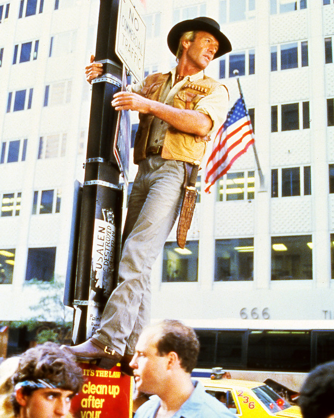 Paul Hogan in Crocodile Dundee climbs New York lamp post 16x20 Canvas Giclee - $69.99