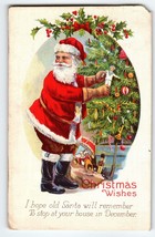Santa Claus Christmas Wishes Postcard Saint Nick Decorates Tree 1511 C Stecher - £7.47 GBP
