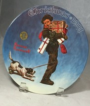 Christmas 1981 decorative plate by Norman Rockwell "wrapped up in Christmas" - $9.85