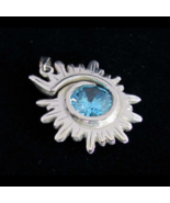Spiral shaped Sterling silver Pendant with a Stunning Light Blue CZ high polishe - $50.00