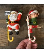 Vintage Lot Of 2 Christmas Santa Claus / Elf Stocking Holder Hanger Shel... - $27.09 CAD