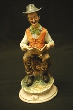 An item in the Pottery & Glass category: Old Vintage Capodimonte Style Art Crown N Man Reading Newspaper Figurine Italy