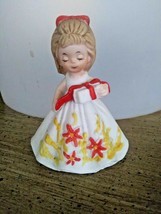 Minature Southern Bell Bisque Figurine Girl With wrapped present Orange bow - $0.98