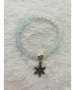 Light green, light blue, and white glass bead bracelet with a snowflake ... - $7.00