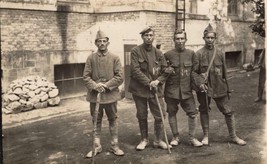 World War 1 real photo post card: 4 Prisoners of War (German soldiers?) - $31.68