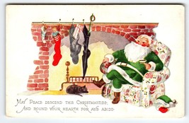 Santa Claus Christmas Postcard Green Suit Chair Black Cat Sleeps By Fireplace - £10.78 GBP