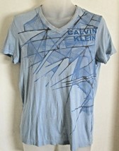 Vintage Calvin Klein Logo Light Blue Abstract Tee Shirt Size Small  - £31.75 GBP