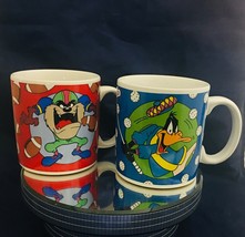 Looney Tunes 2 mugs Daffy Duck Golf & Tasmanian Devil Football 1994 Warner Bros - $14.84