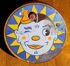 Vintage Tin Litho Round Spinning Noisemaker Winking Clown - $11.95