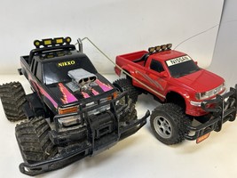 Lot of 2 Nikko RC Trucks – Phoenix Monster &amp; Nissan Frontier 27MHz/49MHz... - $54.40