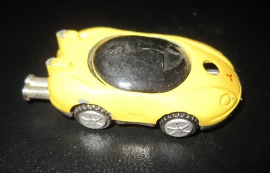 Vintage NOVELTY YELLOW SPORTSCAR Small Palm Size Gas Butane Lighter - $4.99