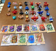 Bakugan Battle Brawlers mixed Lot of 27 Figures with metal cards and case - $99.00