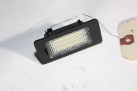 2007-10  E92 BMW 328i COUPE REAR TRUNK LID LICENSE PLATE LIGHT ILLUMINATOR M1199 image 3