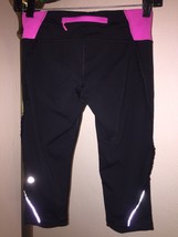 LULULEMON Run Fast Free Crop Capri Sz 4 Black/Pink Tiny Ruffle Down Leg - £39.56 GBP