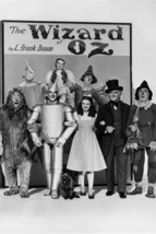 The Wizard of Oz Judy Garland and cast Pose in front of giant L.Frank Ba... - $23.99