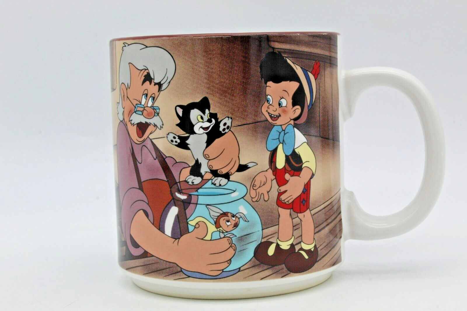 1990 Walt Disney's Pinocchio Coffee Mug Figaro Geppetto Goldie Scene Vintage  - $11.79