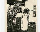 Unusual Couple Holding Hands and Carrying a Jug Black and White Photo  - $21.78