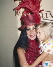 Cher in red sequined outfit and hat with daughter Chastity 1970 16x20 Canvas - $69.99