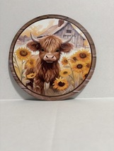 Young Highland Cow in a Field of Sunflowers - $333.13 MXN