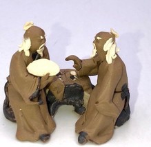 Miniature Ceramic Figurine Two Mud Men Sitting On A Bench Playing Chess ... - £5.54 GBP