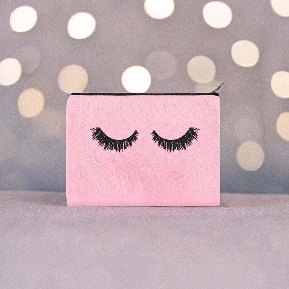 Pink Canvas with Black Eyelashes Cosmetic Makeup Bag, a Versatile Travel Pouch.