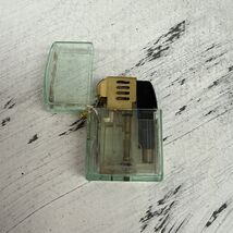 NOVELTY COLLECTIBLE  CLEAR GREEN PLASTIC BLINKING LIGHT LIGHTER - $18.81