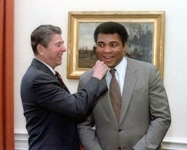 President Ronald Reagan greets Muhammad Ali with a right hook 11x14 photo - $1,799.00