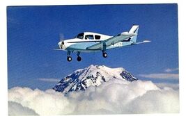 Beechcraft Musketeer Postcard Over Mt Ranier Washington - $14.87