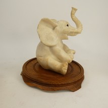 Vintage Baby Elephant Figurine Sitting Trunk Up Happy Mini wooden base  SBJKA - $9.00