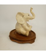 Vintage Baby Elephant Figurine Sitting Trunk Up Happy Mini wooden base  ... - £6.88 GBP