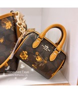 NWT Coach Mini Rowan Bag Charm In Signature Canvas With Floral Print CCF12 - $163.94 CAD