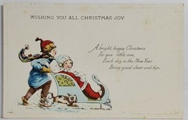 Christmas Wishes Boy Pushing Girl in Sleigh Dog Alongside Postcard T9 - $3.95