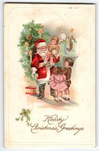 Santa Claus Christmas Postcard Saint Nick Holding Child Hearty Greetings Emboss - $10.35