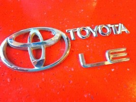 98-02 Toyota Corolla LE emblem badge decal logo OEM Factory Genuine Stock - $17.99