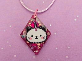 Unicorn Cat Charm Bundle, including resin charm, necklace, mini flashlig... - $11.00