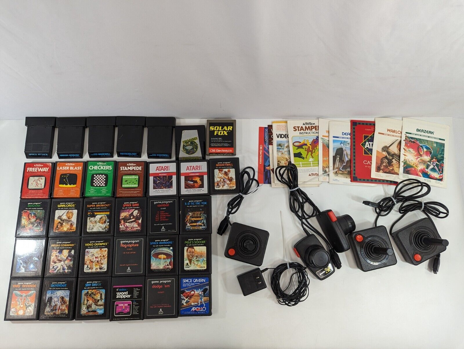 Primary image for Atari 2600 Game & Controller LOT Paddles Joysticks Manuals Solar Fox Warlords ++