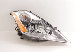 Used aftermarket Nissan Headlight Head Light Lamp 2003-2007 Chip upper mount - $49.50