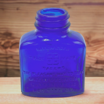 Vtg Milnesia Wafers Embossed Cobalt Blue Glass Bottle 3&quot; Tall New York, NY - £31.93 GBP