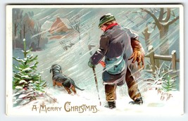 Christmas Postcard Dog Man Blowing Wind Snow Cane 1907 Tuck Series 102 - £15.52 GBP