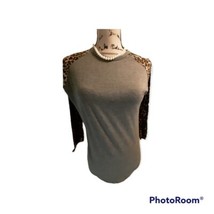 LuLaRoe Animal Print Top Shirt. SZ XS - $91.93 MXN